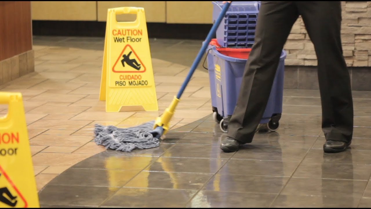 a person cleaning floor.