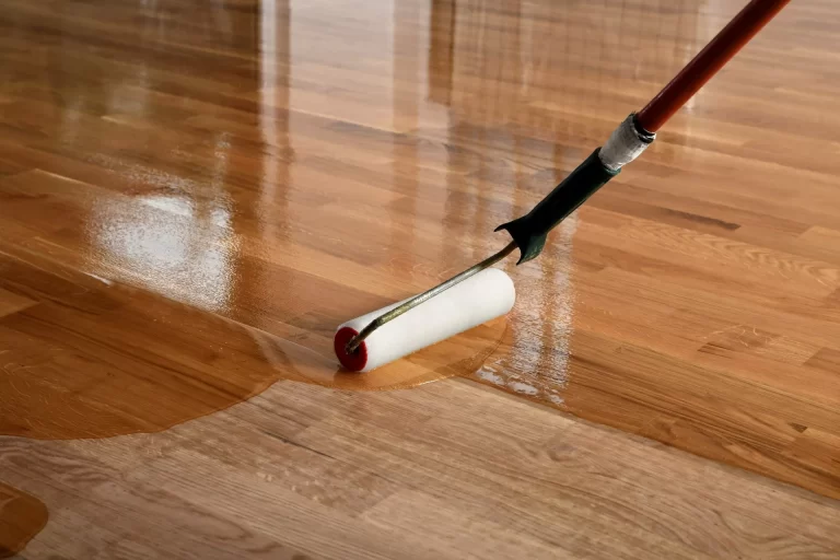 applying polyurethane coating on floor with a roller