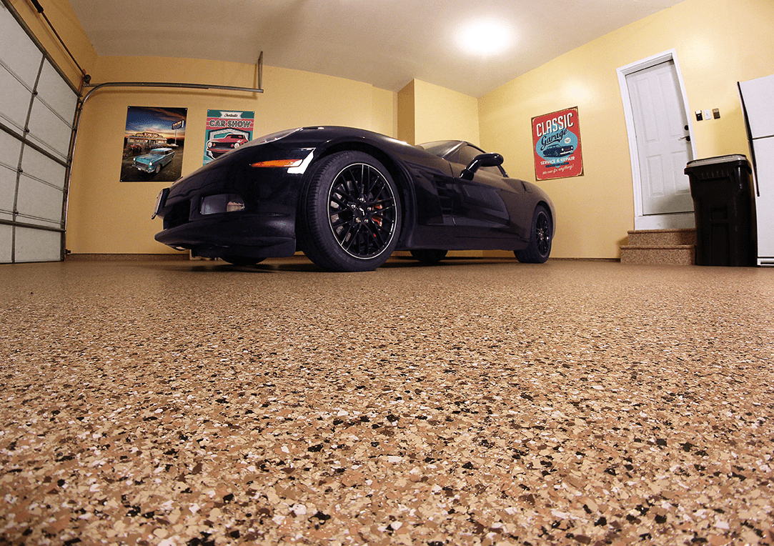 picture of a shiny garage floor and a black car can also be seen in the background.